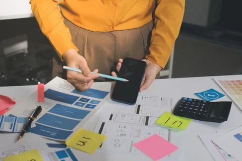 Team of UI UX web designer are working together to develop mobile responsiv.. Stock Photos