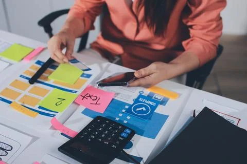 Team of UI UX web designer are working together to develop mobile responsiv.. 写真素材