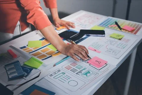 Team of UI UX web designer are working together to develop mobile responsiv.. Stock Photos