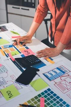 Team of UI UX web designer are working together to develop mobile responsiv.. Stock Photos