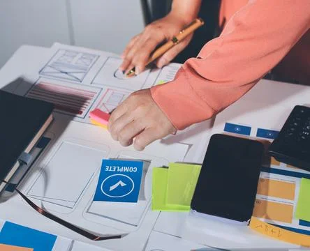 Team of UI UX web designer are working together to develop mobile responsiv.. Stock Photos