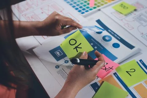 Team of UI UX web designer are working together to develop mobile responsiv.. Stock Photos