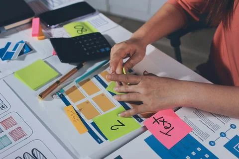 Team of UI UX web designer are working together to develop mobile responsiv.. Stock Photos