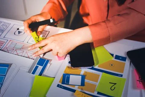 Team of UI UX web designer are working together to develop mobile responsiv.. Stock Photos
