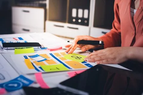 Team of UI UX web designer are working together to develop mobile responsiv.. Stock Photos
