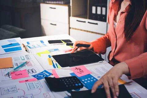 Team of UI UX web designer are working together to develop mobile responsiv.. Stock Photos