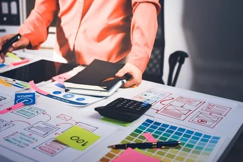 Team of UI UX web designer are working together to develop mobile responsiv.. Stock Photos