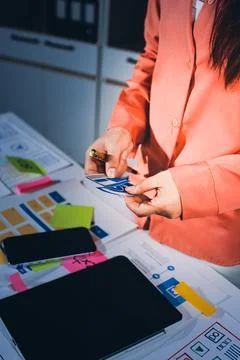Team of UI UX web designer are working together to develop mobile responsiv.. Stock Photos