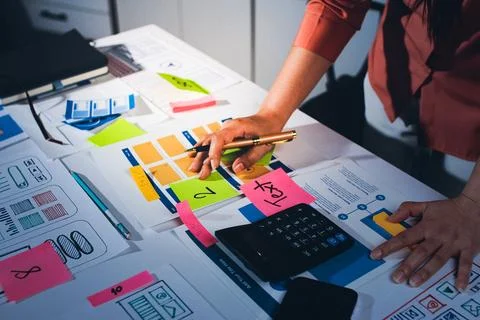 Team of UI UX web designer are working together to develop mobile responsiv.. Stock Photos