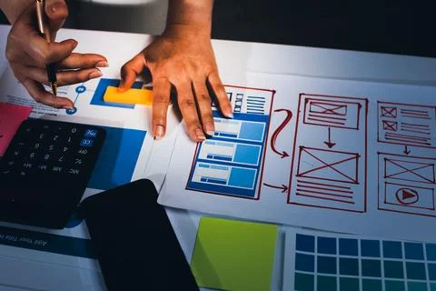 Team of UI UX web designer are working together to develop mobile responsiv.. Stock Photos