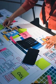 Team of UI UX web designer are working together to develop mobile responsiv.. Stock Photos
