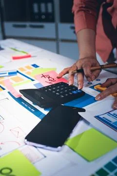 Team of UI UX web designer are working together to develop mobile responsiv.. 库存照片