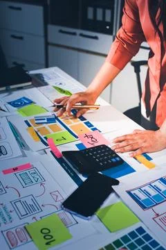 Team of UI UX web designer are working together to develop mobile responsiv.. Stock Photos