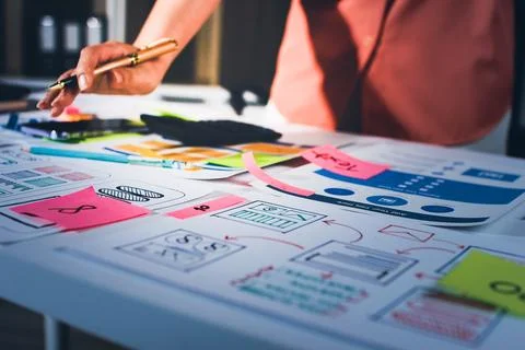 Team of UI UX web designer are working together to develop mobile responsiv.. Stock Photos