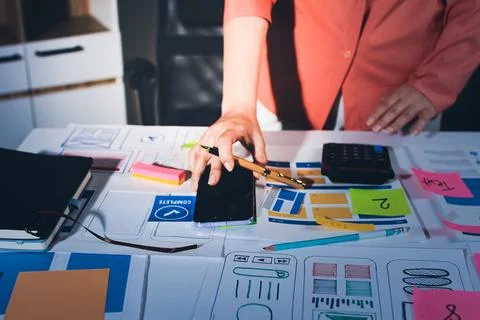 Team of UI UX web designer are working together to develop mobile responsiv.. Stock Photos