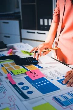 Team of UI UX web designer are working together to develop mobile responsiv.. Stock Photos