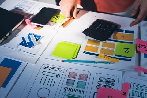 Team of UI UX web designer are working together to develop mobile responsiv.. Stock Photos