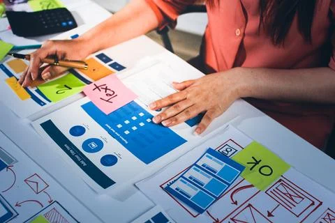 Team of UI UX web designer are working together to develop mobile responsiv.. Stock Photos