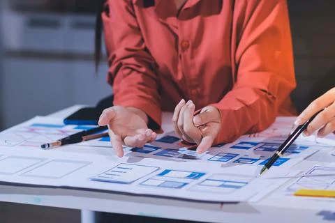 Team of UI UX web designer are working together to develop mobile responsiv.. Stock Photos