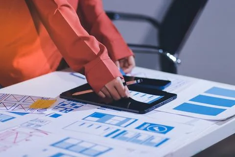 Team of UI UX web designer are working together to develop mobile responsiv.. Stock Photos