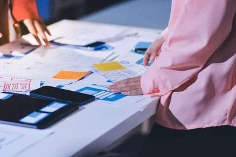 Team of UI UX web designer are working together to develop mobile responsiv.. Stock Photos