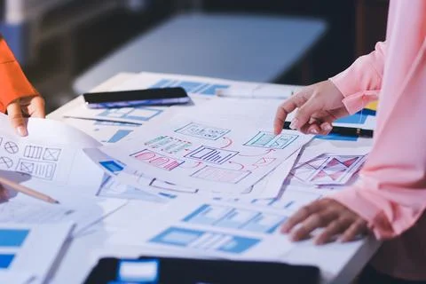 Team of UI UX web designer are working together to develop mobile responsiv.. Stock Photos
