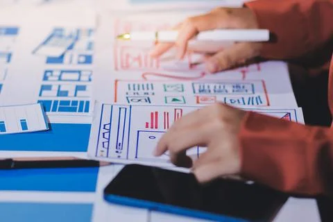 Team of UI UX web designer are working together to develop mobile responsiv.. Stock Photos