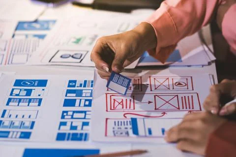 Team of UI UX web designer are working together to develop mobile responsiv.. Stock Photos