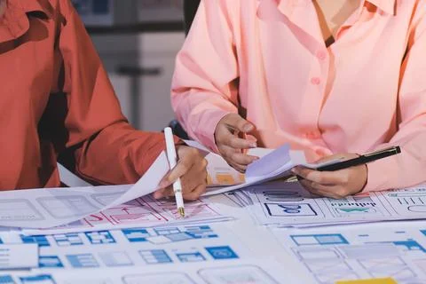 Team of UI UX web designer are working together to develop mobile responsiv.. Stock Photos