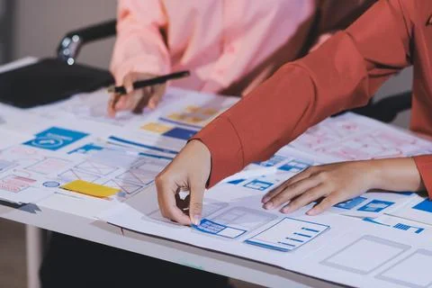 Team of UI UX web designer are working together to develop mobile responsiv.. Stock Photos