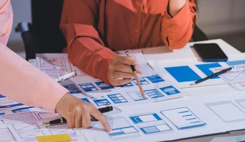 Team of UI UX web designer are working together to develop mobile responsiv.. Stock Photos