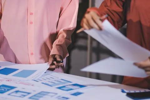 Team of UI UX web designer are working together to develop mobile responsiv.. Stock Photos