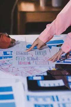 Team of UI UX web designer are working together to develop mobile responsiv.. Stock Photos