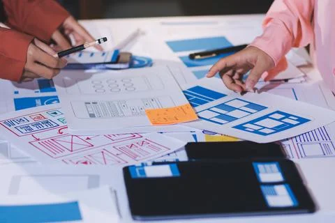 Team of UI UX web designer are working together to develop mobile responsiv.. Stock Photos
