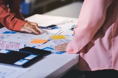 Team of UI UX web designer are working together to develop mobile responsiv.. Stock Photos
