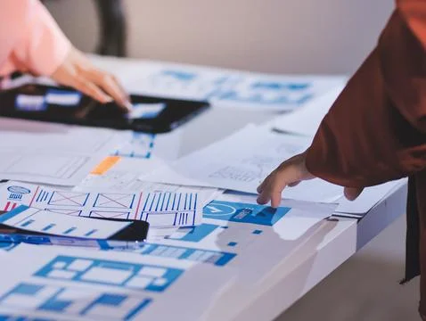 Team of UI UX web designer are working together to develop mobile responsiv.. Stock Photos