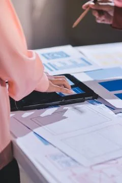 Team of UI UX web designer are working together to develop mobile responsiv.. Stock Photos
