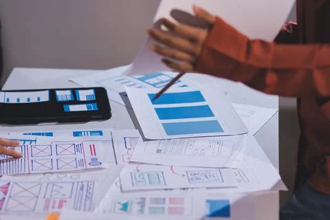 Team of UI UX web designer are working together to develop mobile responsiv.. Stock Photos