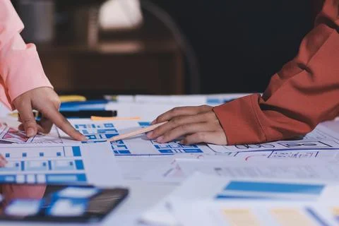Team of UI UX web designer are working together to develop mobile responsiv.. Stock Photos