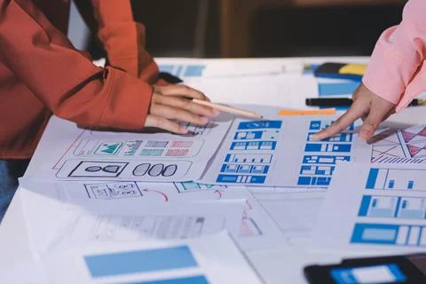 Team of UI UX web designer are working together to develop mobile responsiv.. Stock Photos