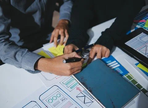Team of UI UX web designer are working together to develop mobile responsiv.. Stock Photos