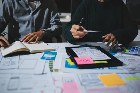 Team of UI UX web designer are working together to develop mobile responsiv.. Stock Photos