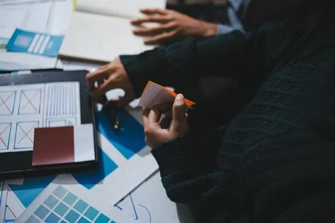 Team of UI UX web designer are working together to develop mobile responsiv.. Stock Photos