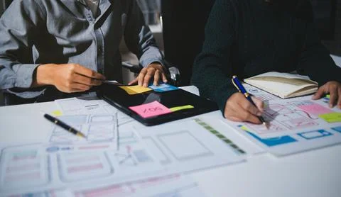 Team of UI UX web designer are working together to develop mobile responsiv.. Stock Photos