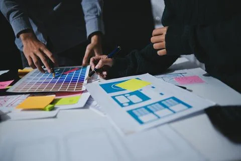 Team of UI UX web designer are working together to develop mobile responsiv.. Stock Photos