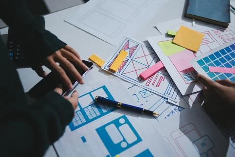 Team of UI UX web designer are working together to develop mobile responsiv.. Stock Photos