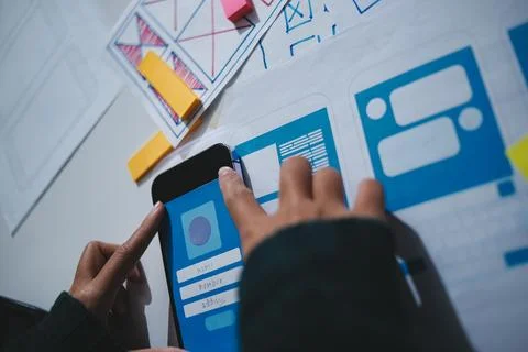 Team of UI UX web designer are working together to develop mobile responsiv.. Stock Photos