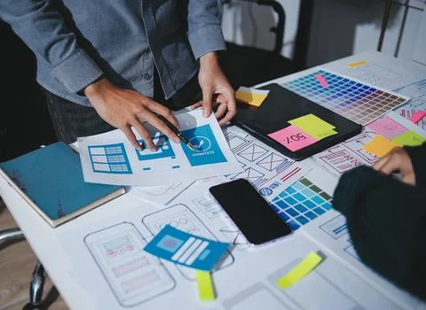 Team of UI UX web designer are working together to develop mobile responsiv.. Stock Photos