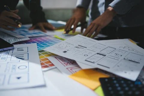 Team of UI UX web designer are working together to develop mobile responsiv.. Stock Photos