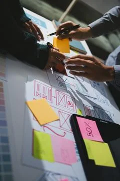 Team of UI UX web designer are working together to develop mobile responsiv.. Stock Photos